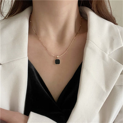 Gold/Silver Studded Necklace with Deep Black Pendant