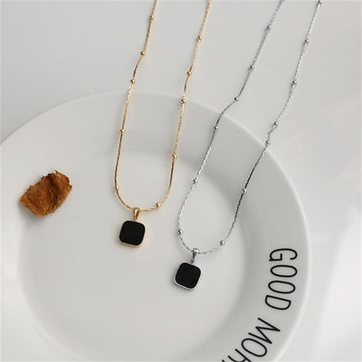 Gold/Silver Studded Necklace with Deep Black Pendant