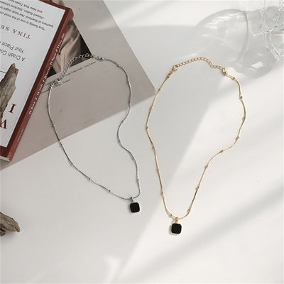 Gold/Silver Studded Necklace with Deep Black Pendant