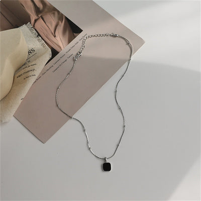 Gold/Silver Studded Necklace with Deep Black Pendant